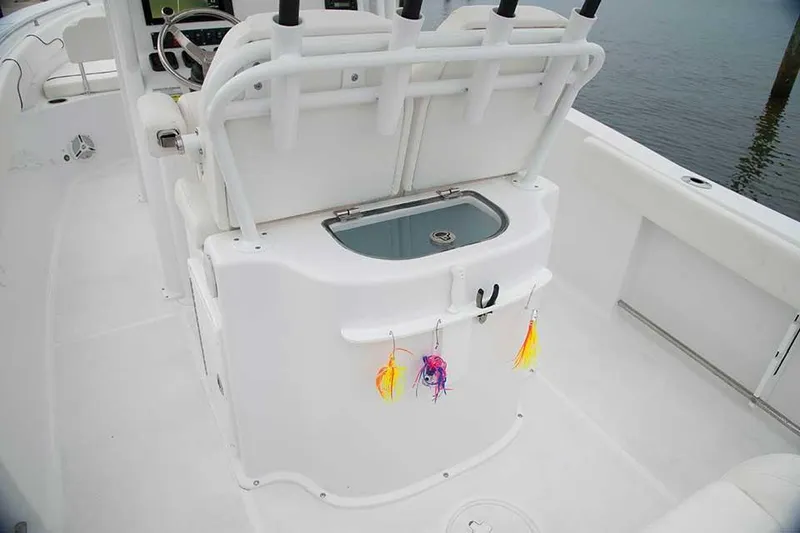 Slide: The Image of 2019 Sea Hunt Gamefish 25 boat on trailer in marina parking lot. - 8