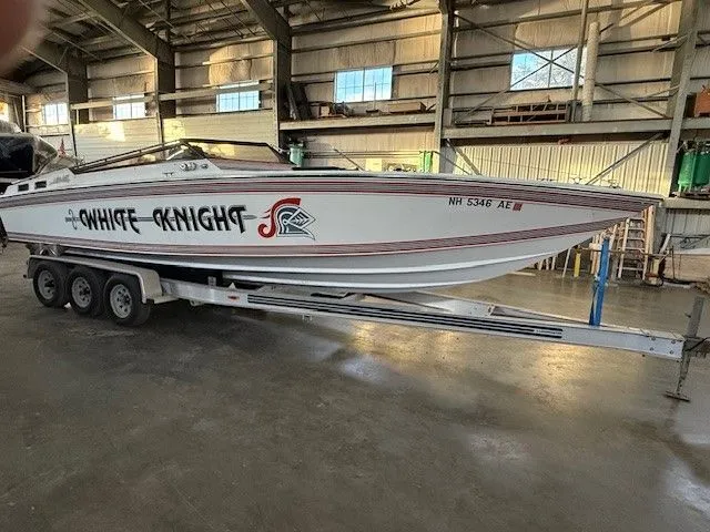 The Image of 1983 Mirage 314 SZ boat on trailer in warehouse. - 0