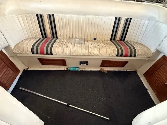Slide: The Image of Interior of a 1983 Mirage 314 SZ with striped seating. - 6