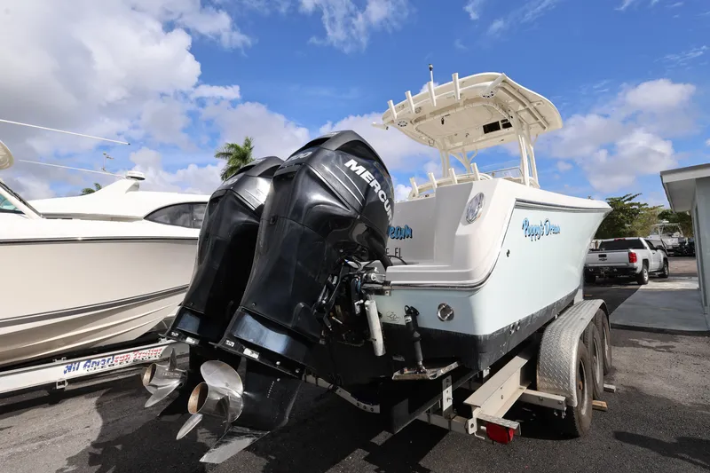 Slide: The Image of 2014 Sailfish 270 CC boat with dual Mercury engines on a trailer. - 4