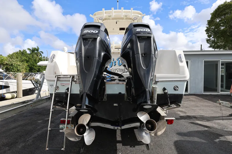 Slide: The Image of 2014 Sailfish 270 CC boat with dual 200 horsepower outboard engines. - 5