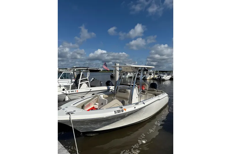 The Image of 2024 Key West 239 FS boat docked under a clear blue sky. - 0