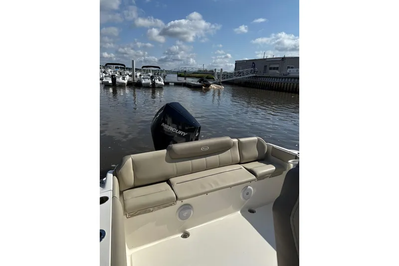 Slide: The Image of 2024 Key West 239 FS boat with Mercury engine docked at marina. - 7