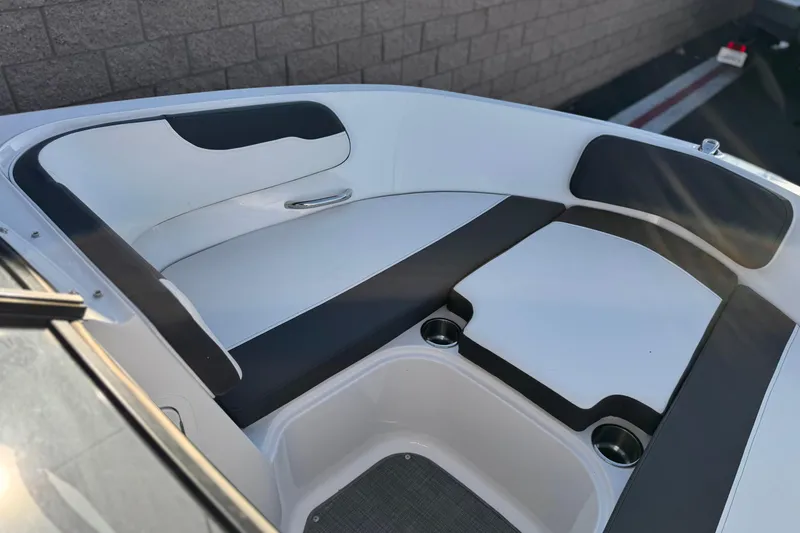 Slide: The Image of 2022 Bayliner VR5 Bowrider I/O interior with sleek seating and cup holders. - 11