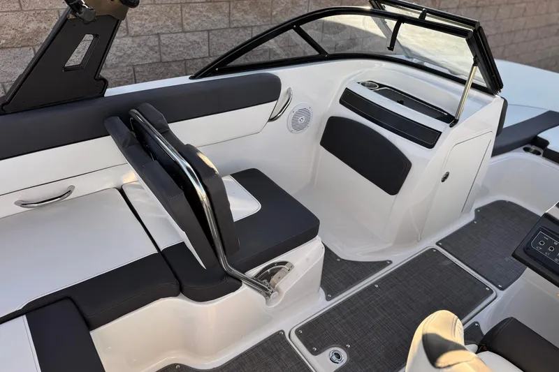 Slide: The Image of 2022 Bayliner VR5 Bowrider I/O interior with sleek seating and modern dashboard design. - 18