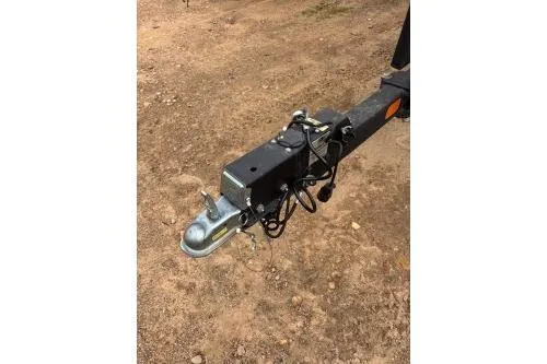 Slide: The Image of Trailer hitch of 2023 Tracker Pro Team 195 TXW Tournament Edition on dirt ground. - 16