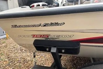 Slide: The Image of 2023 Tracker Pro Team 195 TXW Tournament Edition boat, side view with branding. - 3
