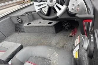 Slide: The Image of 2023 Tracker Pro Team 195 TXW Tournament Edition boat interior with steering wheel and seating. - 7