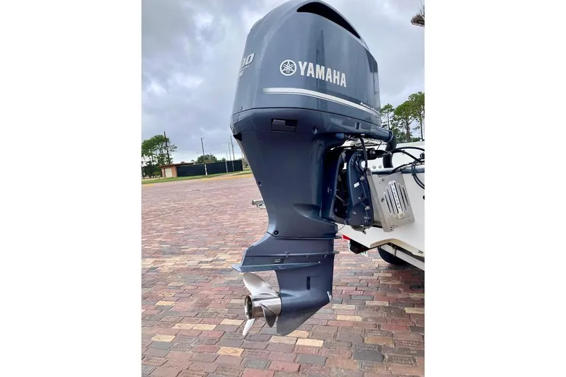 Slide: The Image of Yamaha outboard motor on 2007 Coastal Bay 2310 boat, parked on brick pavement. - 12