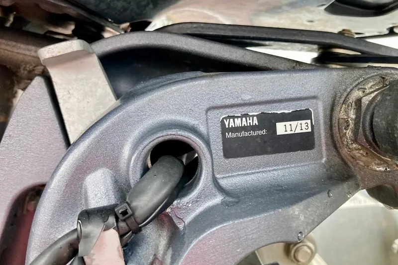 Slide: The Image of Close-up of Yamaha component with manufacturing date, November 2013, on Coastal Bay 2310, 2007 model. - 13