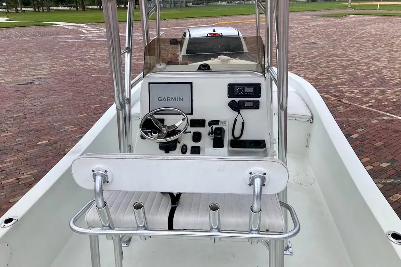 Slide: The Image of 2007 Coastal Bay 2310 boat interior with Garmin navigation system and steering wheel. - 18