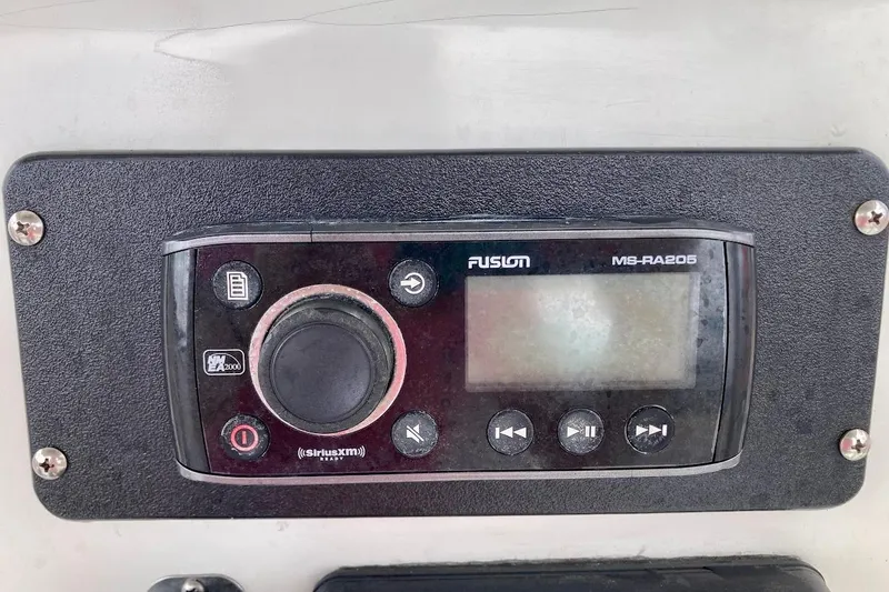 Slide: The Image of Fusion MS-RA205 marine stereo on a 2007 Coastal Bay 2310 boat dashboard. - 23