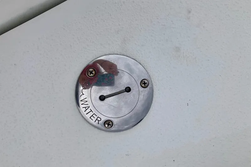 Slide: The Image of Water fill cap on 2007 Coastal Bay 2310 boat deck. - 29