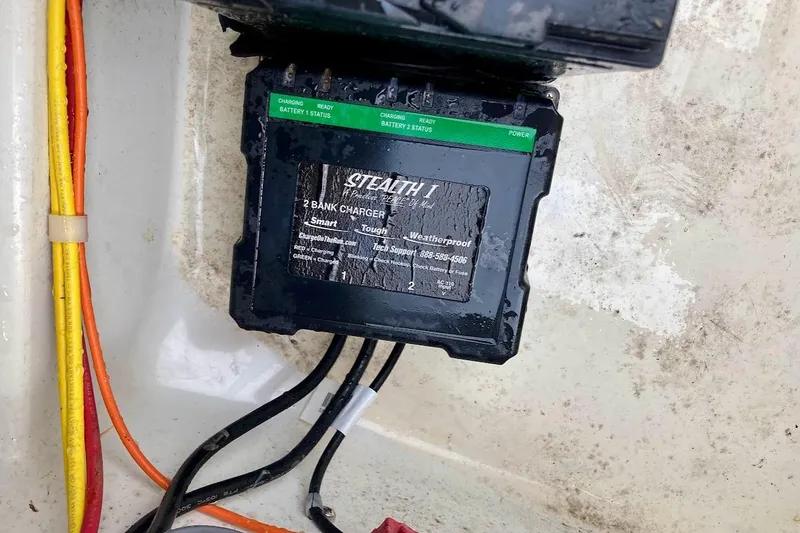 Slide: The Image of Weatherproof Stealth 1 two-bank charger in a 2007 Coastal Bay 2310 boat. - 32