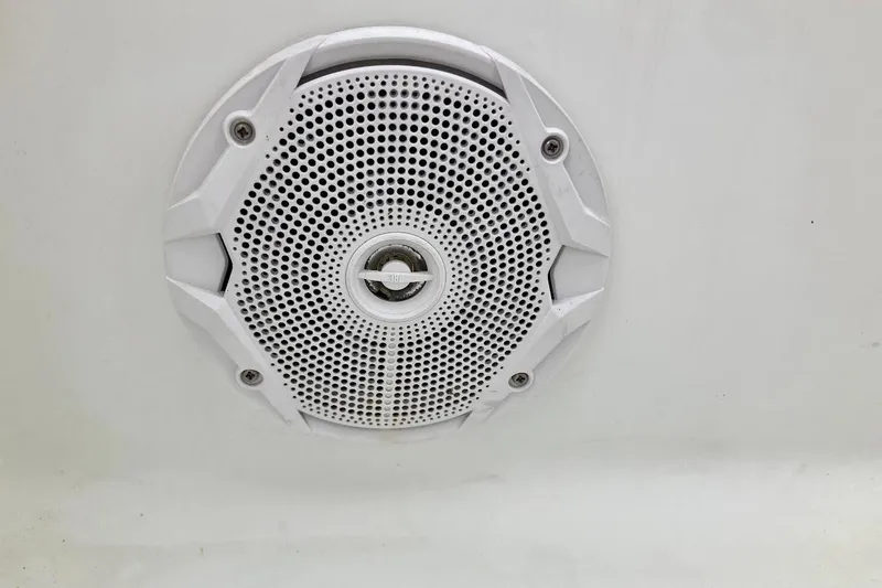 Slide: The Image of White speaker grille on a 2007 Coastal Bay 2310 boat interior. - 35