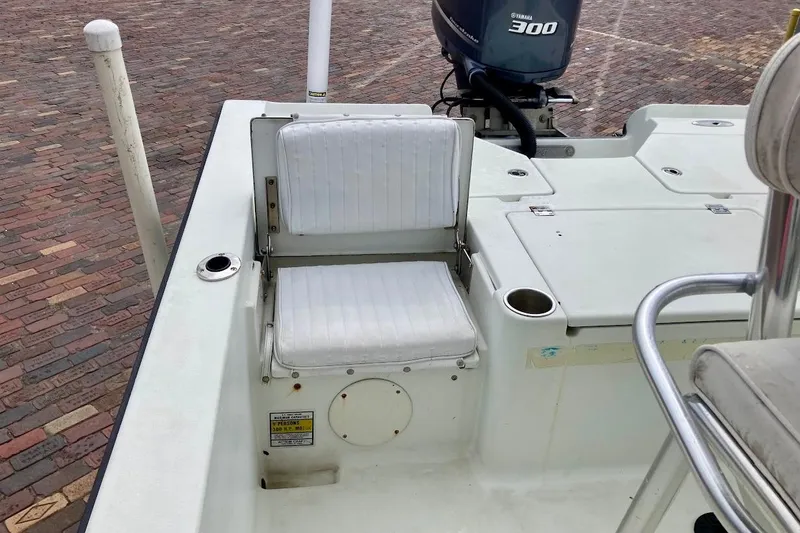 Slide: The Image of 2007 Coastal Bay 2310 boat interior with seating and Yamaha 300 engine. - 38