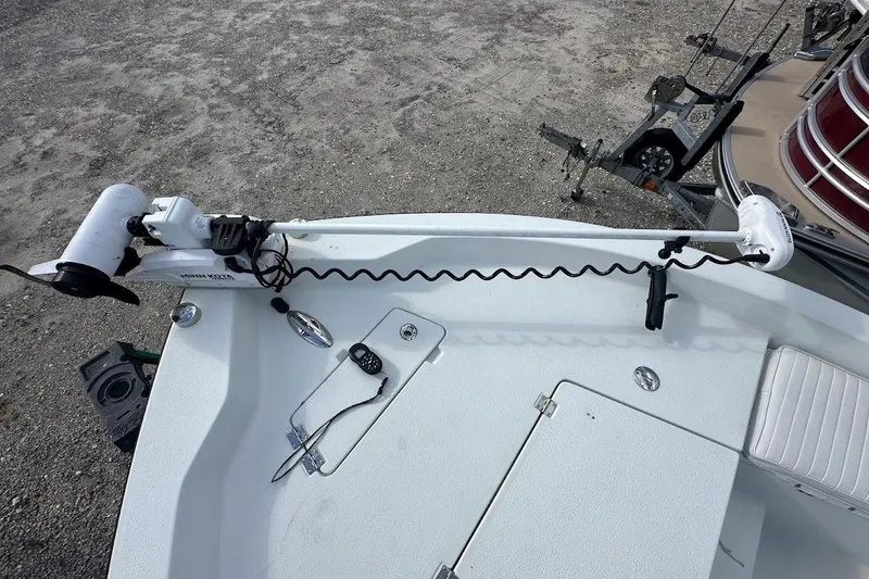 Slide: The Image of Bow of a 2007 Coastal Bay 2310 boat with trolling motor and control panel. - 8