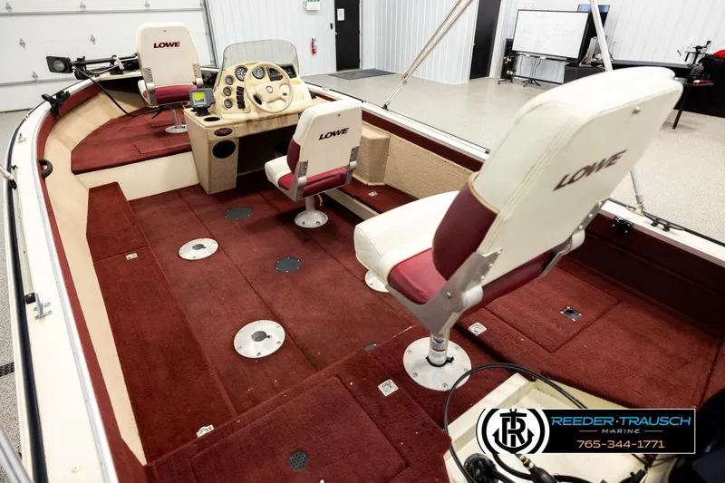 Slide: The Image of 1999 Lowe Sea Nymph V 179 SCX boat interior with red carpet and seating. - 10