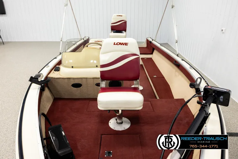 Slide: The Image of 1999 Lowe Sea Nymph V 179 SCX boat interior with red and white seating. - 15