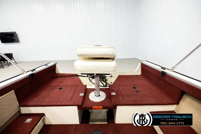 Slide: The Image of 1999 Lowe Sea Nymph V 179 SCX boat interior with red carpet and swivel seat. - 17