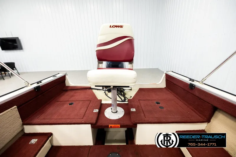 Slide: The Image of 1999 Lowe Sea Nymph V 179 SCX boat interior with red and white seating. - 18