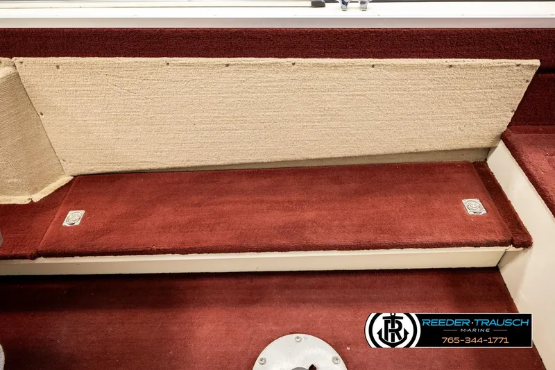 Slide: The Image of Interior of 1999 Lowe Sea Nymph V 179 SCX boat with red carpeted seating. - 20