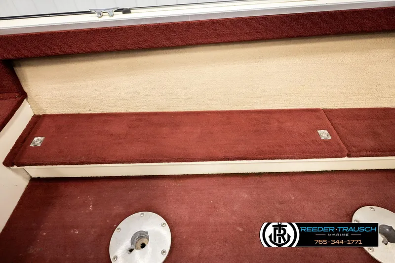 Slide: The Image of Interior of 1999 Lowe Sea Nymph V 179 SCX boat with red carpet and beige accents. - 21