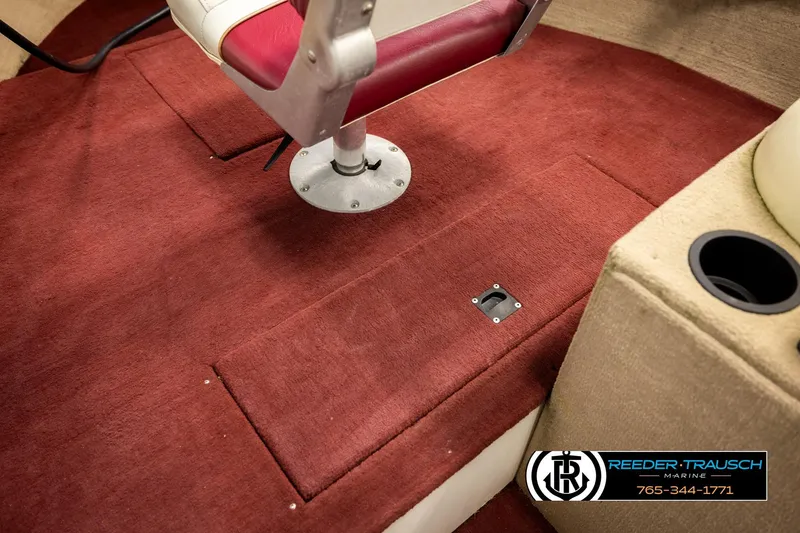 Slide: The Image of Red carpeted interior of 1999 Lowe Sea Nymph V 179 SCX boat with swivel seat. - 22