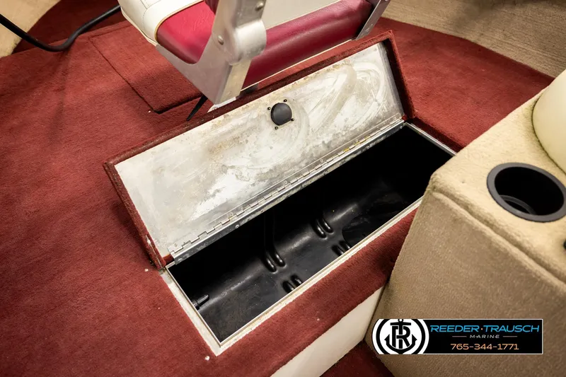 Slide: The Image of 1999 Lowe Sea Nymph V 179 SCX boat interior with open storage compartment. - 23