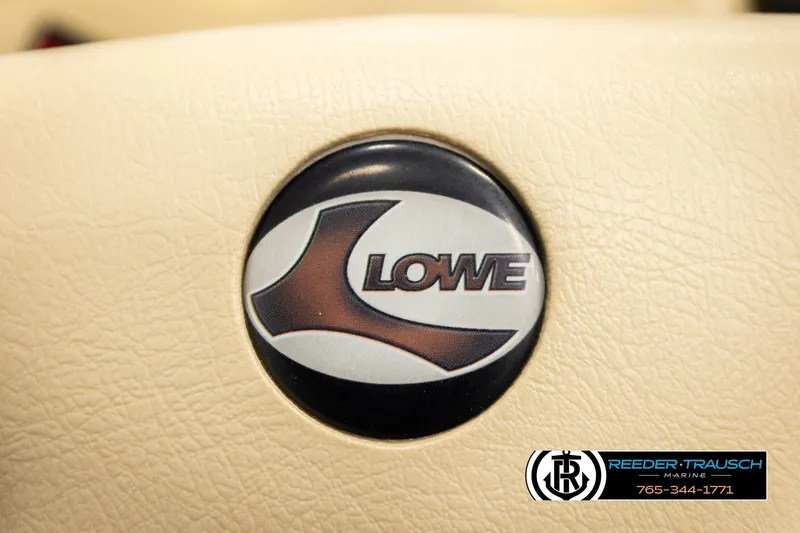 Slide: The Image of 1999 Lowe Sea Nymph V 179 SCX logo on beige background, Reeder-Trausch Marine branding. - 27