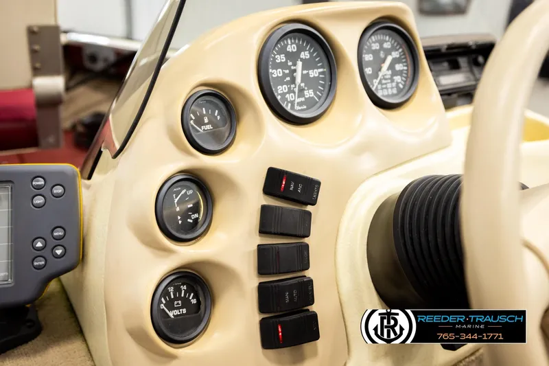 Slide: The Image of Dashboard of a 1999 Lowe Sea Nymph V 179 SCX boat with gauges and controls. - 30