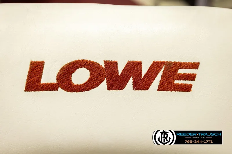 Slide: The Image of 1999 Lowe Sea Nymph V 179 SCX boat seat with embroidered logo, Reeder-Trausch Marine contact. - 37