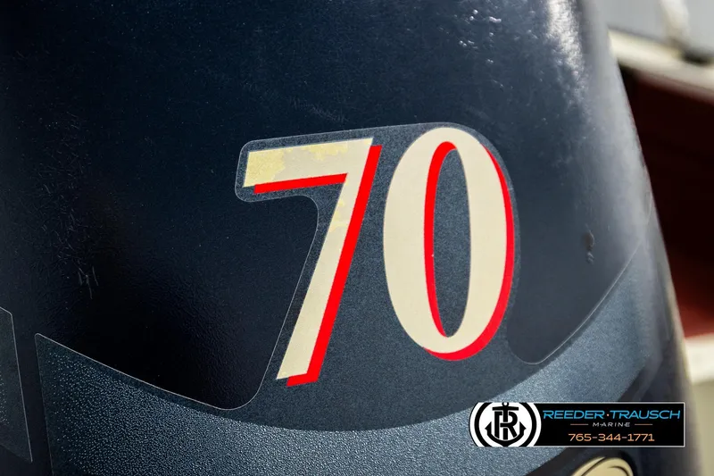 Slide: The Image of Close-up of a 1999 Lowe Sea Nymph V 179 SCX boat engine with "70" decal. - 46