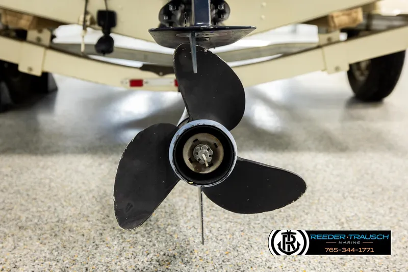 Slide: The Image of 1999 Lowe Sea Nymph V 179 SCX boat propeller close-up in a showroom. - 47