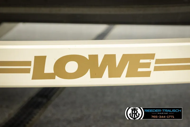 Slide: The Image of 1999 Lowe Sea Nymph V 179 SCX boat logo with Reeder-Trausch Marine contact. - 49