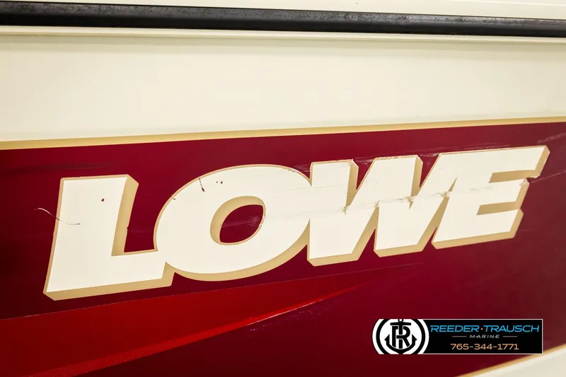 Slide: The Image of 1999 Lowe Sea Nymph V 179 SCX boat logo with Reeder-Trausch Marine branding. - 50