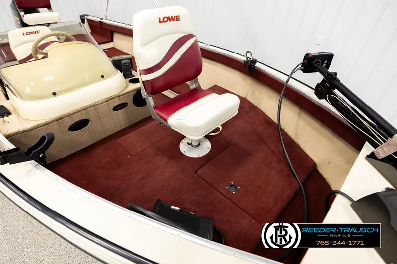 Slide: The Image of 1999 Lowe Sea Nymph V 179 SCX boat interior with red and white seating. - 8