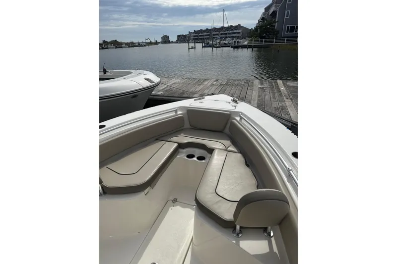 Slide: The Image of 2024 Key West 239 FS boat docked by a serene waterfront. - 3
