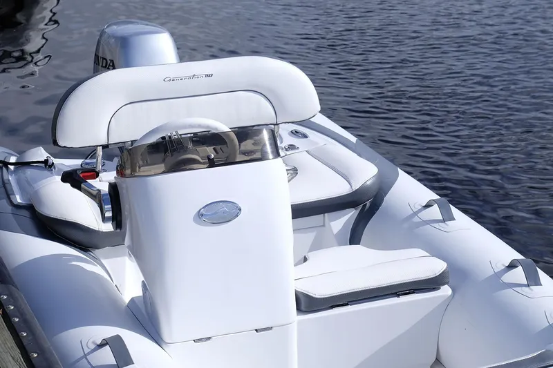 Slide: The Image of Manufacturer Provided Image: Walker Bay Generation 11 LTE 2025 boat on water, featuring sleek white design. - 6