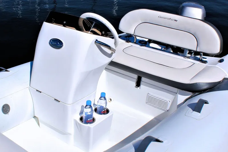 Slide: The Image of Manufacturer Provided Image: 2025 Walker Bay Generation 11 LTE boat interior with steering console and seating. - 7