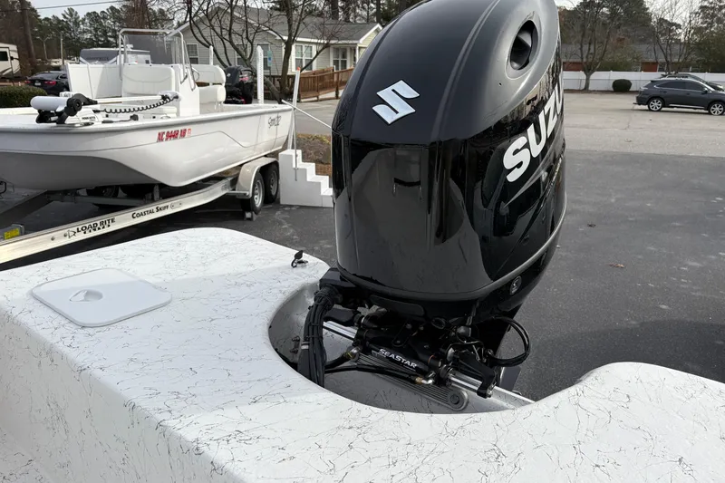 Slide: The Image of 2026 Coastal Skiff 271 with Suzuki outboard motor on trailer. - 20