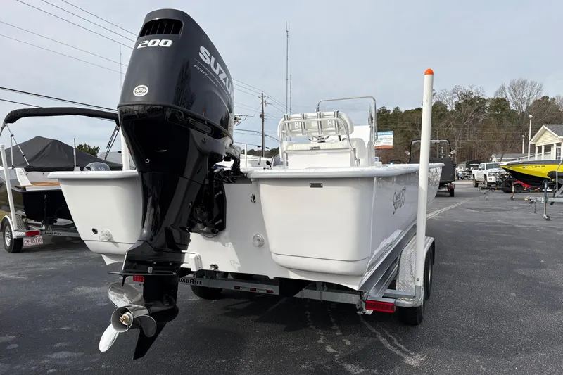 Slide: The Image of 2026 Coastal Skiff 271 boat with Suzuki 200 outboard motor on trailer. - 3