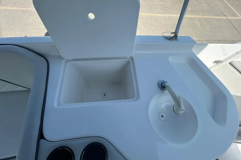 Slide: The Image of 2022 Sea Pro Citation 2400 boat sink and storage compartment detail. - 10