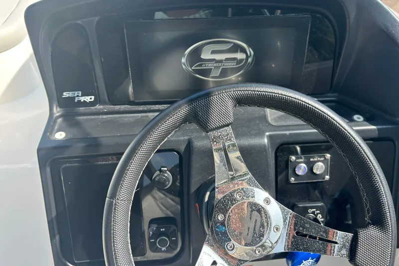 Slide: The Image of Steering wheel and dashboard of 2022 Sea Pro Citation 2400 boat. - 11