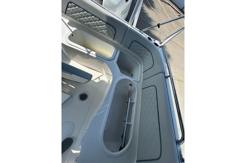 Slide: The Image of 2022 Sea Pro Citation 2400 boat interior with quilted seating and storage compartments. - 17