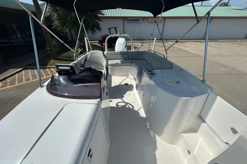 Slide: The Image of 2022 Sea Pro Citation 2400 boat interior with seating and Garmin navigation system. - 19