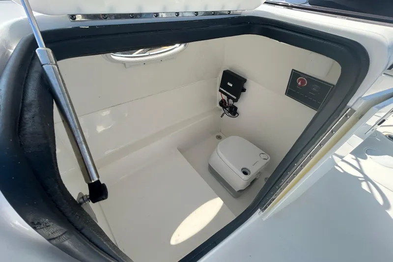 Slide: The Image of 2022 Sea Pro Citation 2400 boat interior with compact marine toilet. - 25