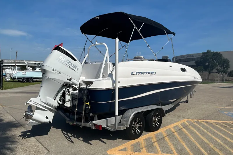 Slide: The Image of 2022 Sea Pro Citation 2400 boat with Suzuki outboard motor on trailer. - 3