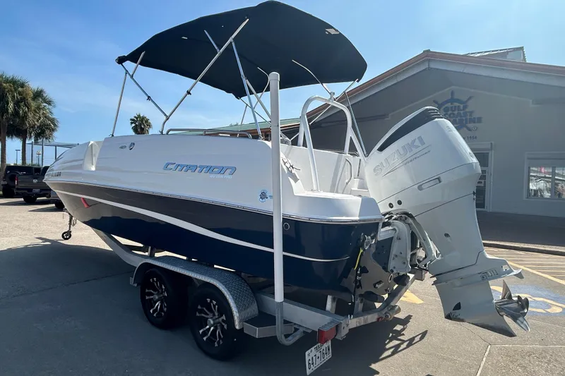 Slide: The Image of 2022 Sea Pro Citation 2400 boat with Suzuki outboard motor on trailer. - 5