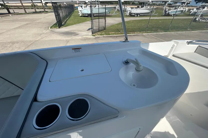 Slide: The Image of 2022 Sea Pro Citation 2400 boat sink and cup holders on deck. - 9